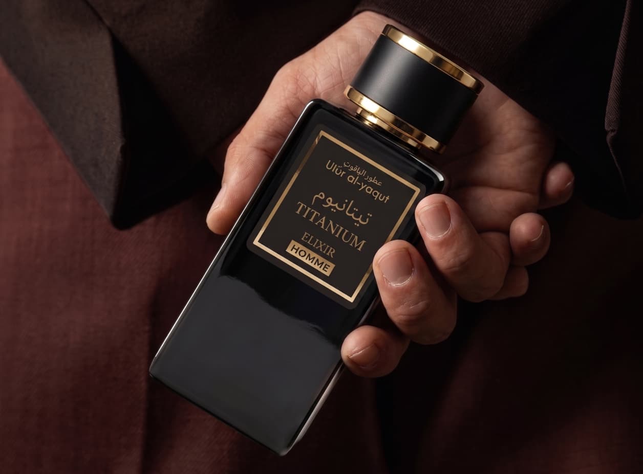 Hand holding Titanium Elixir perfume bottle
